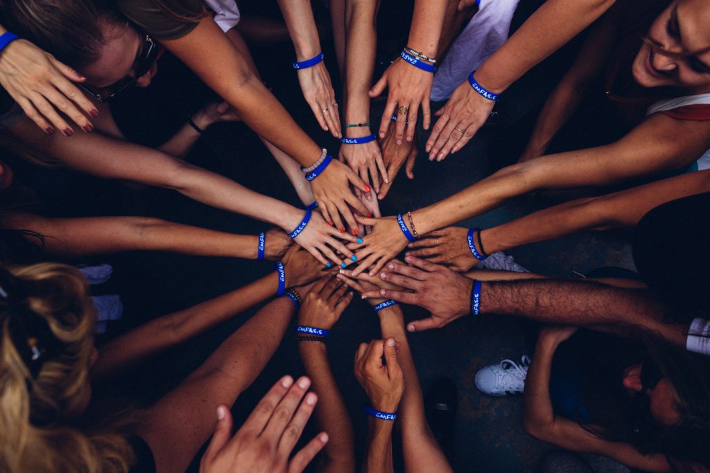 many hands together photo